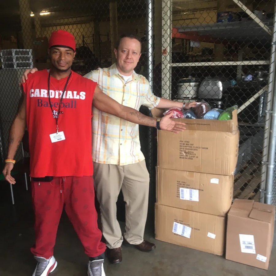 Brayson Verzella delivering boxes of blankets to people in need