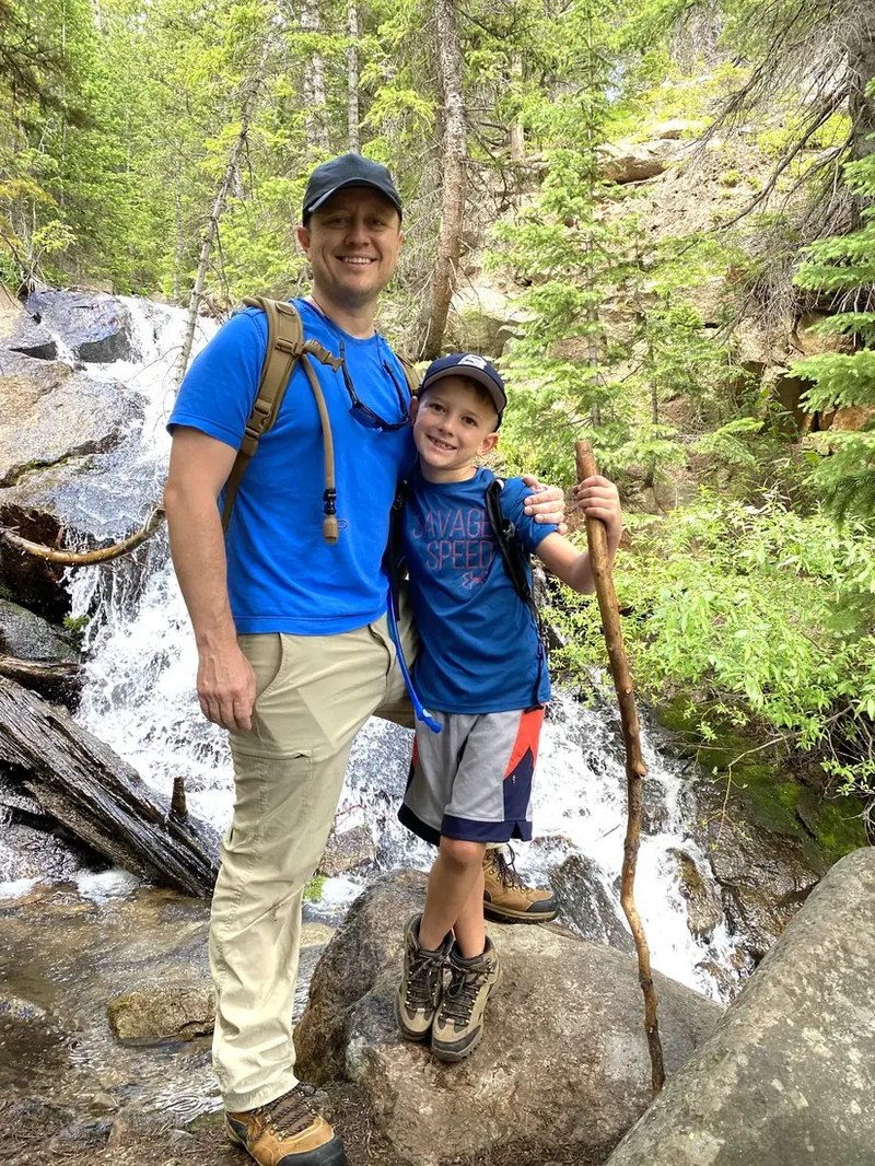Brayson Verzella hiking with his son